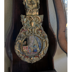 Rellotge de l'avantsala en fusta policromada.