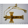 Large cross hanging on gold metal chain in gold.