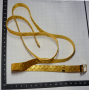 Cintura in maglia di metallo dorato.