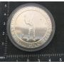Pièce de monnaie en argent commémorant le XXV Jeux Olympiques.