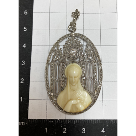 Religious medal in white gold of law.