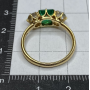 Ring in 18k gold, emerald, and diamonds.